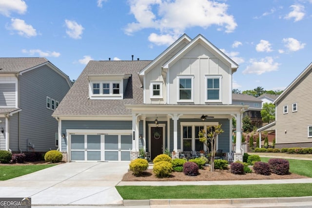 4207 N Carver Dr, Atlanta, GA 30360 - view of front of house with covered porch, board and batten siding, concrete driveway, and roof with shingles