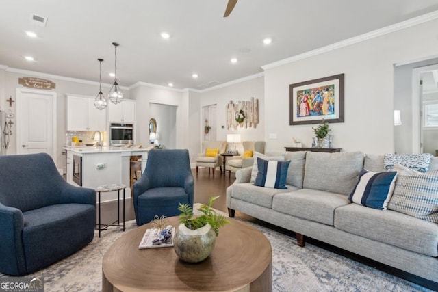 4207 N Carver Dr, Atlanta, GA 30360 - living room featuring recessed lighting, crown molding, ceiling fan, and light wood-style flooring