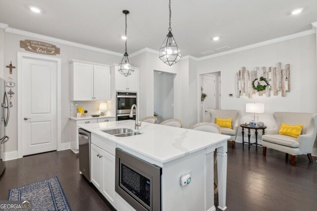 4207 N Carver Dr, Atlanta, GA 30360 - kitchen featuring a sink, appliances with stainless steel finishes, a kitchen breakfast bar, and light countertops