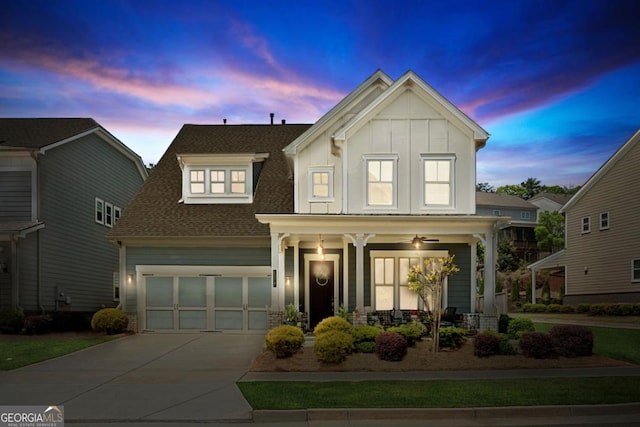4207 N Carver Dr, Atlanta, GA 30360 - view of front facade featuring covered porch, driveway, board and batten siding, and roof with shingles