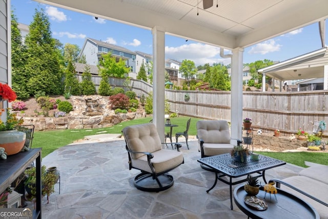 4207 N Carver Dr, Atlanta, GA 30360 - fenced backyard featuring a patio area, a ceiling fan, outdoor lounge area, and a residential view