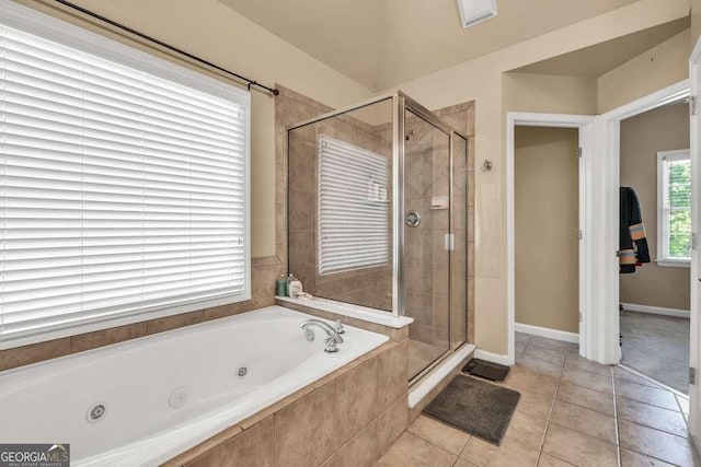 bathroom with tile patterned floors, baseboards, a whirlpool tub, and a shower stall
