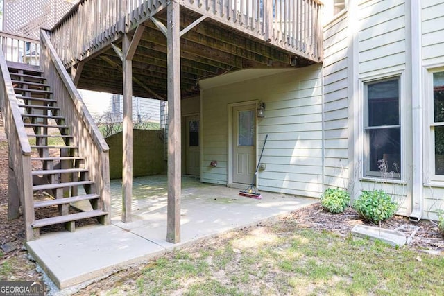 view of patio / terrace featuring stairway and a wooden deck