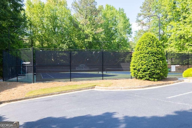 view of sport court with fence