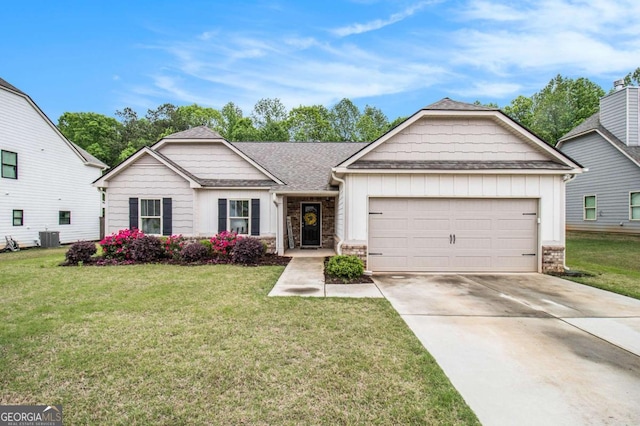 3383 Kottayam Ct, Statham, GA 30666 - view of front of property featuring board and batten siding, an attached garage, driveway, and a front yard