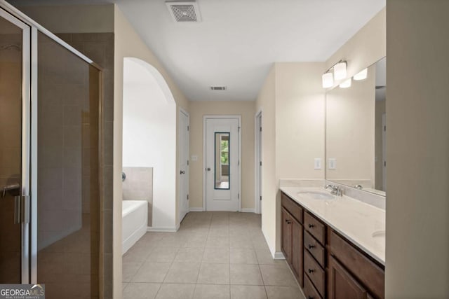 3940 Village Estates Ct, Cumming, GA 30040 - bathroom featuring double vanity, a garden tub, a shower stall, and tile patterned flooring