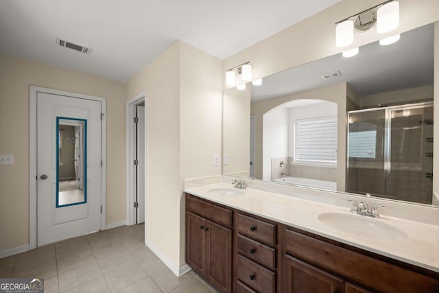 3940 Village Estates Ct, Cumming, GA 30040 - bathroom with a garden tub, a stall shower, double vanity, and tile patterned floors