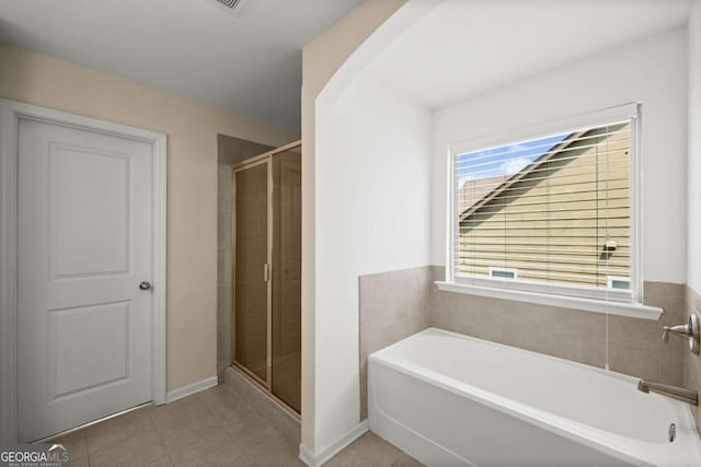 3940 Village Estates Ct, Cumming, GA 30040 - bathroom featuring a bath, a shower stall, and tile patterned flooring