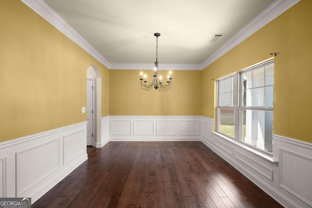 3940 Village Estates Ct, Cumming, GA 30040 - unfurnished dining area featuring a chandelier, dark wood-style flooring, arched walkways, wainscoting, and ornamental molding