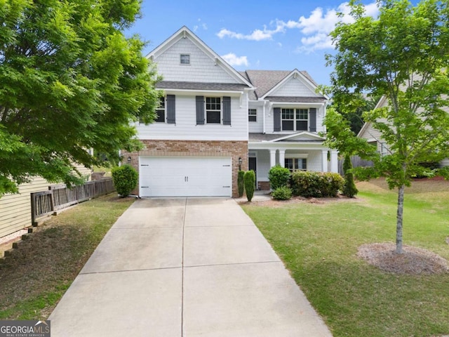 3940 Village Estates Ct, Cumming, GA 30040 - view of front of house featuring brick siding, an attached garage, driveway, and covered porch