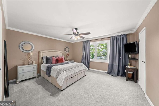 331 Lakemoore Dr NE Unit C, Atlanta, GA 30342 - bedroom featuring crown molding, baseboards, ceiling fan, and carpet