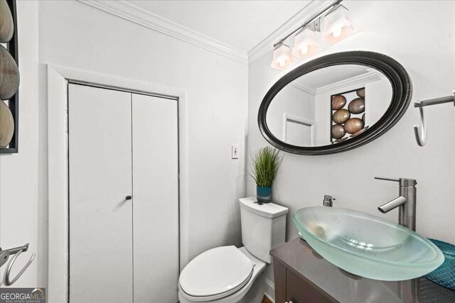331 Lakemoore Dr NE Unit C, Atlanta, GA 30342 - bathroom with crown molding, toilet, and vanity