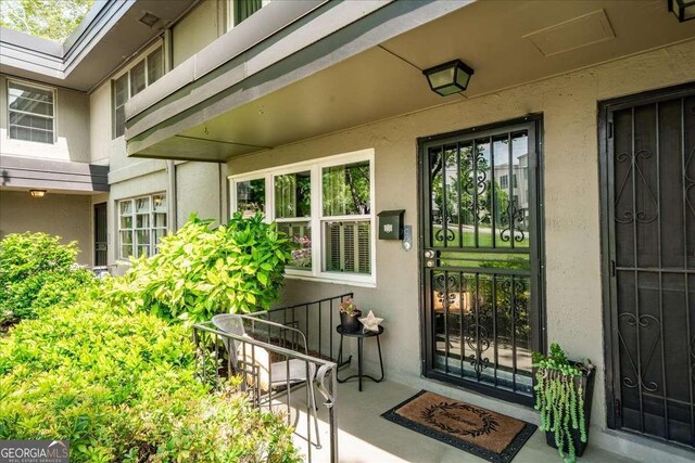331 Lakemoore Dr NE Unit C, Atlanta, GA 30342 - property entrance with stucco siding