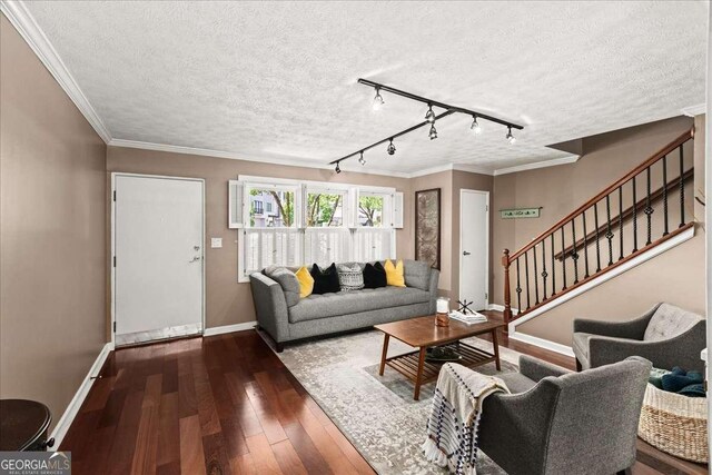331 Lakemoore Dr NE Unit C, Atlanta, GA 30342 - living room with a textured ceiling, rail lighting, baseboards, wood finished floors, and visible vents
