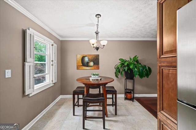 331 Lakemoore Dr NE Unit C, Atlanta, GA 30342 - dining space featuring baseboards, ornamental molding, a textured ceiling, and a notable chandelier