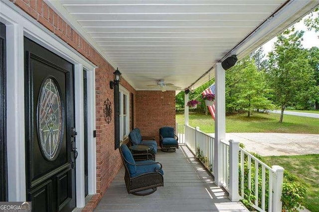 wooden terrace featuring covered porch