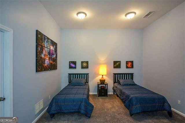 bedroom featuring visible vents, carpet flooring, and baseboards