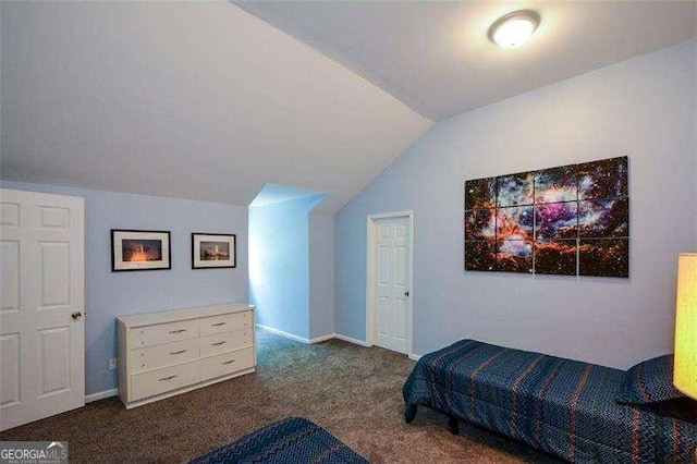 carpeted bedroom with vaulted ceiling