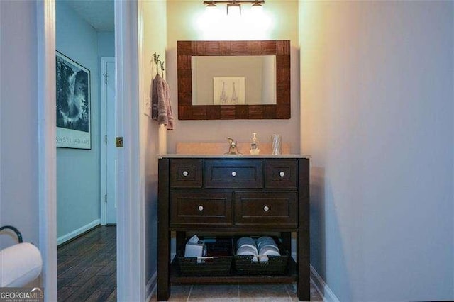 bathroom with baseboards and vanity