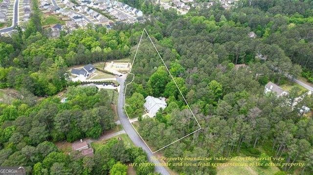 aerial view featuring a view of trees