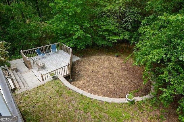 view of yard with a wooden deck