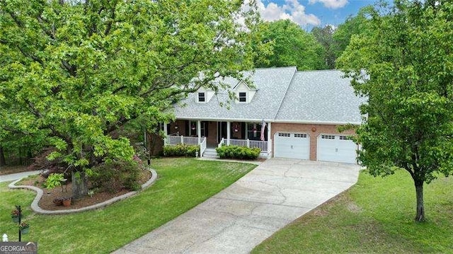 cape cod home featuring covered porch, driveway, a front lawn, and a garage
