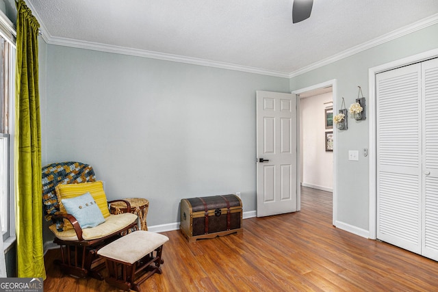 211 Phillips St, Clarkesville, GA 30523 - sitting room with wood finished floors, ornamental molding, ceiling fan, and baseboards