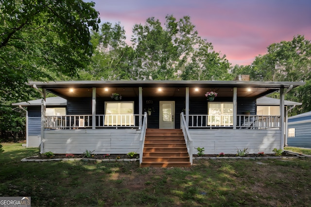 211 Phillips St, Clarkesville, GA 30523 - view of front of house with covered porch, stairway, and a chimney