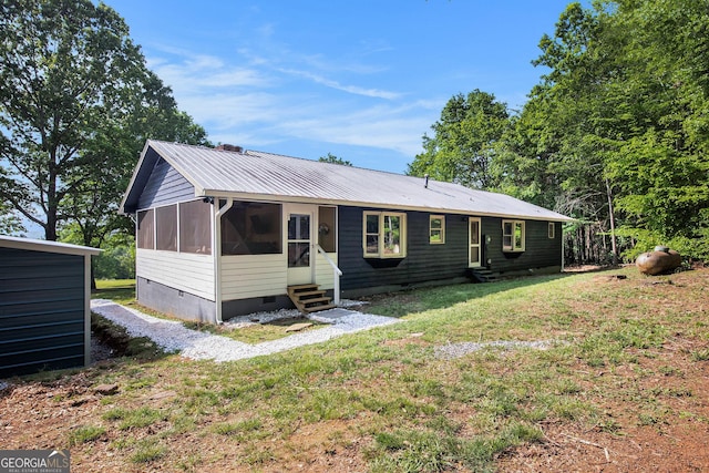 211 Phillips St, Clarkesville, GA 30523 - view of front of property featuring entry steps, crawl space, metal roof, a front lawn, and a sunroom