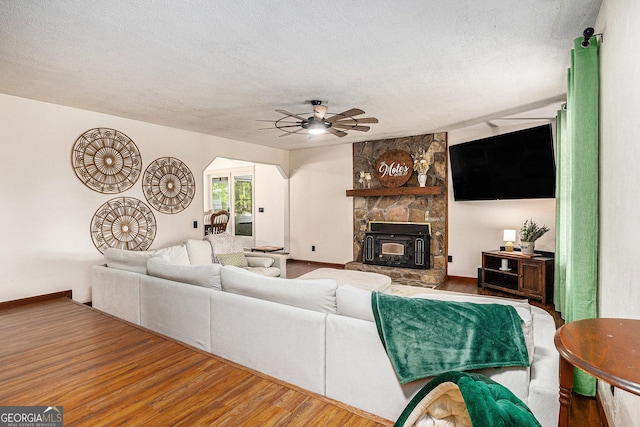 211 Phillips St, Clarkesville, GA 30523 - living area featuring ceiling fan, a textured ceiling, wood finished floors, and baseboards
