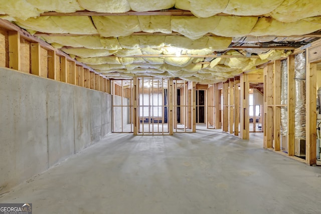 miscellaneous room with unfinished concrete flooring
