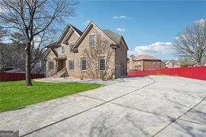 2656 Old Norcross Rd, Tucker, GA 30084 - view of front facade featuring driveway and a front lawn