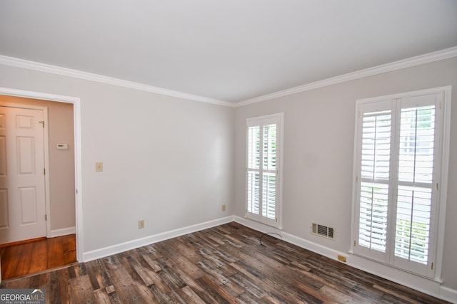 615 Woodwork Way, Roswell, GA 30076 - unfurnished room with visible vents, ornamental molding, baseboards, and wood finished floors