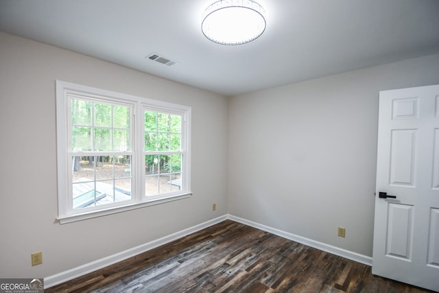 615 Woodwork Way, Roswell, GA 30076 - spare room with baseboards, dark wood finished floors, and visible vents