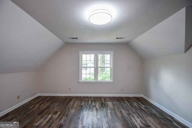 615 Woodwork Way, Roswell, GA 30076 - additional living space with baseboards, visible vents, and dark wood-type flooring