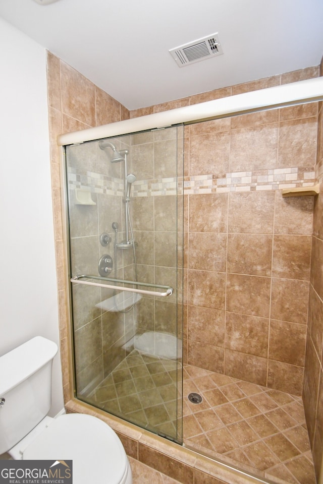 615 Woodwork Way, Roswell, GA 30076 - full bathroom with a stall shower, toilet, and visible vents