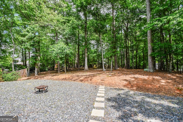 615 Woodwork Way, Roswell, GA 30076 - view of yard featuring an outdoor fire pit and fence