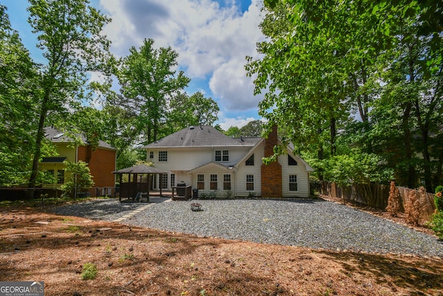 615 Woodwork Way, Roswell, GA 30076 - back of house with fence, a patio, a gazebo, and central air condition unit