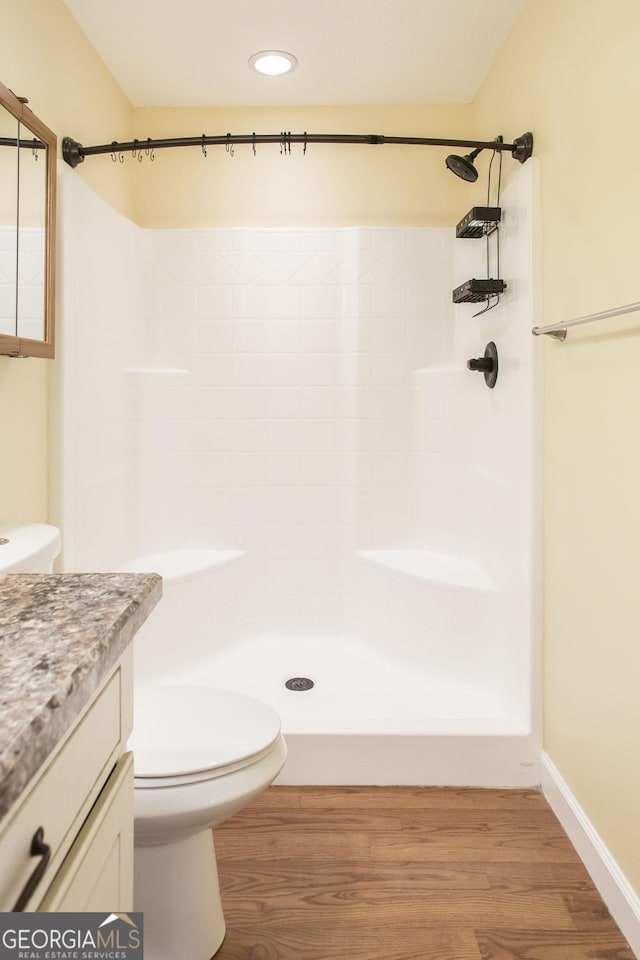 19 Live Oak Ln, Waycross, GA 31503 - bathroom with vanity, a shower, wood finished floors, and recessed lighting