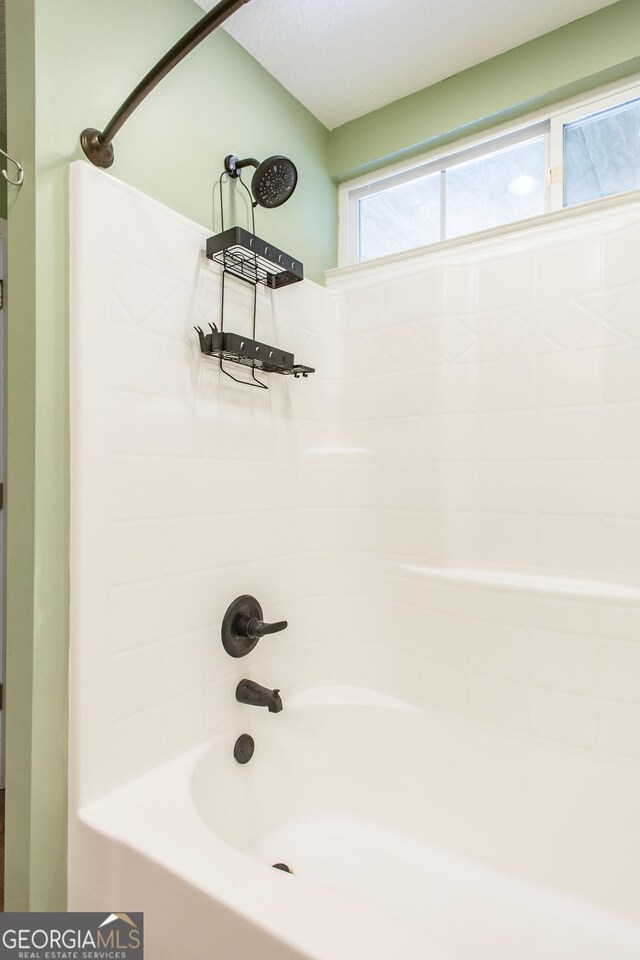 full bath with bathing tub / shower combination