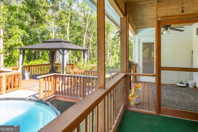 19 Live Oak Ln, Waycross, GA 31503 - wooden deck featuring a gazebo, a ceiling fan, and view of wooded area
