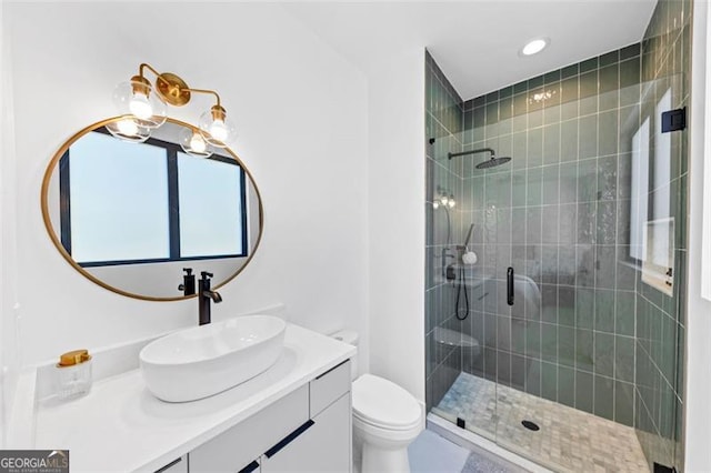 bathroom with toilet, recessed lighting, a shower stall, and vanity