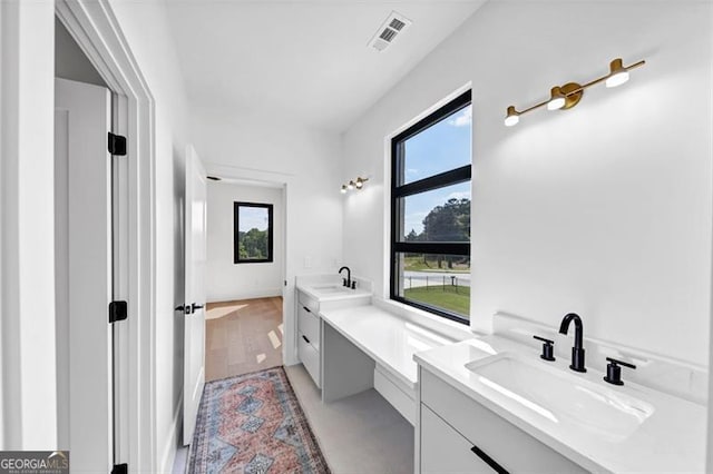 bathroom featuring vanity and visible vents