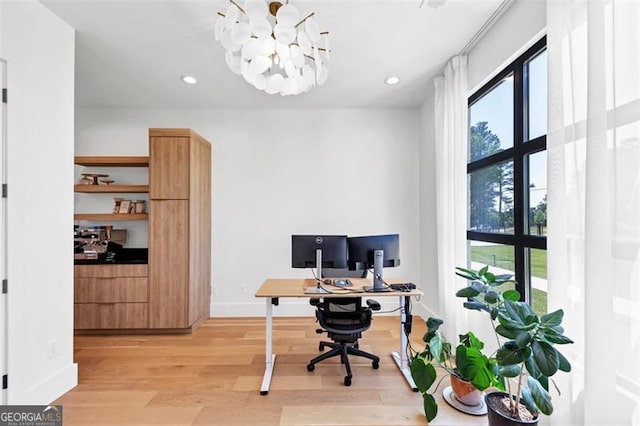 office space with an inviting chandelier, recessed lighting, baseboards, and light wood-type flooring