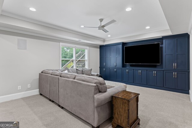 living area featuring recessed lighting, ceiling fan, light carpet, and a raised ceiling
