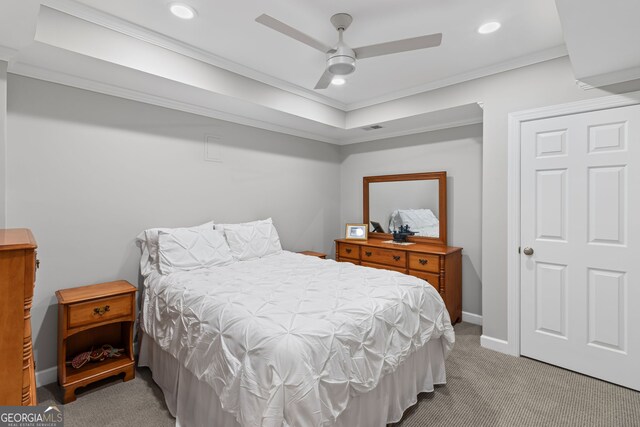 bedroom with carpet flooring, baseboards, visible vents, and ornamental molding