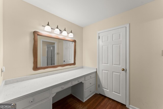 full bath with an enclosed shower, wood finished floors, and vanity