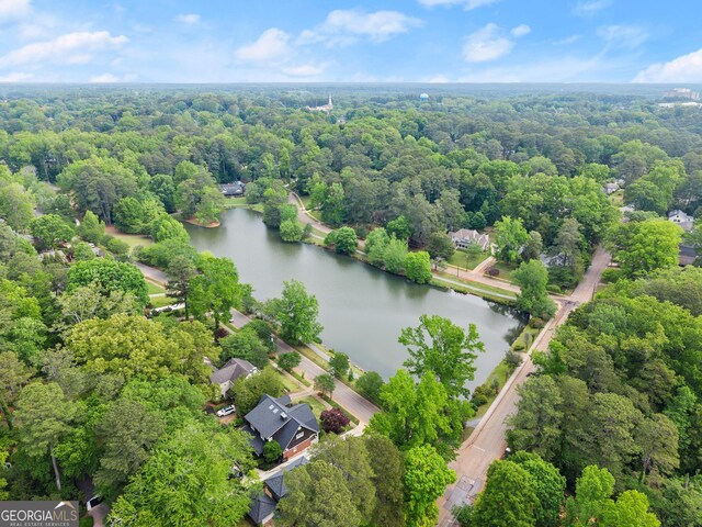 aerial view featuring a water view and a forest view