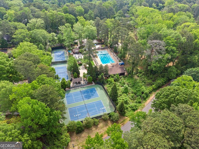 birds eye view of property featuring a wooded view