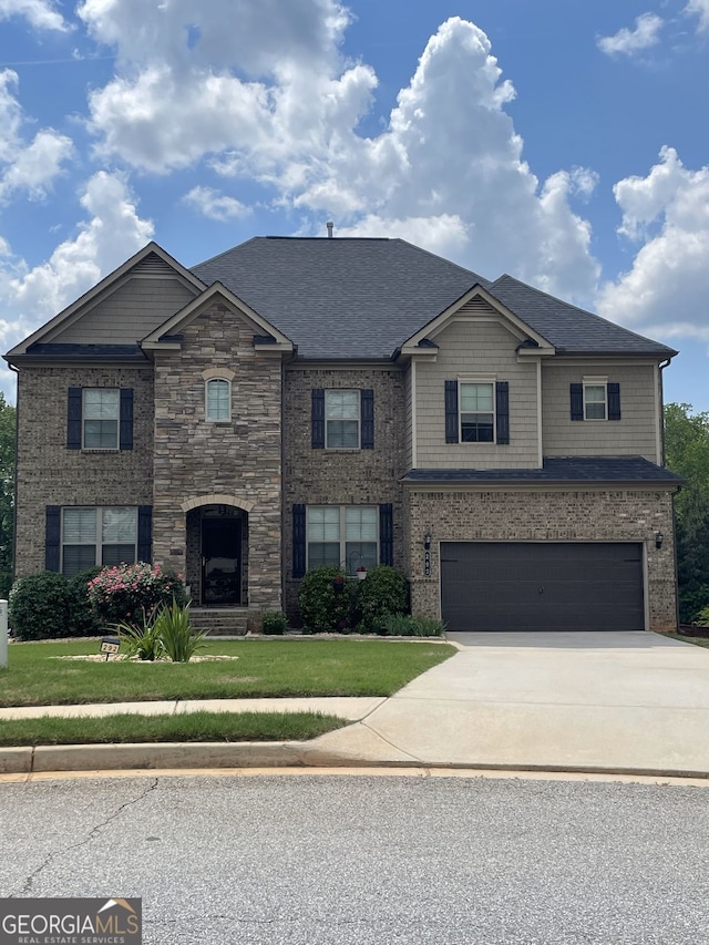 292 Aylesbury Blvd, Mcdonough, GA 30252 - craftsman-style house with concrete driveway, an attached garage, a front yard, and a shingled roof